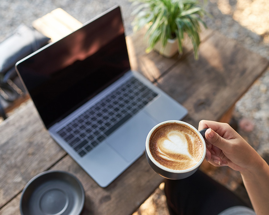 Latte and laptop computer for online therapy in Irvine with Jennifer Overley, LCSW