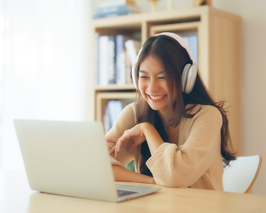 Asian woman having an online therapy session in Irvine, CA